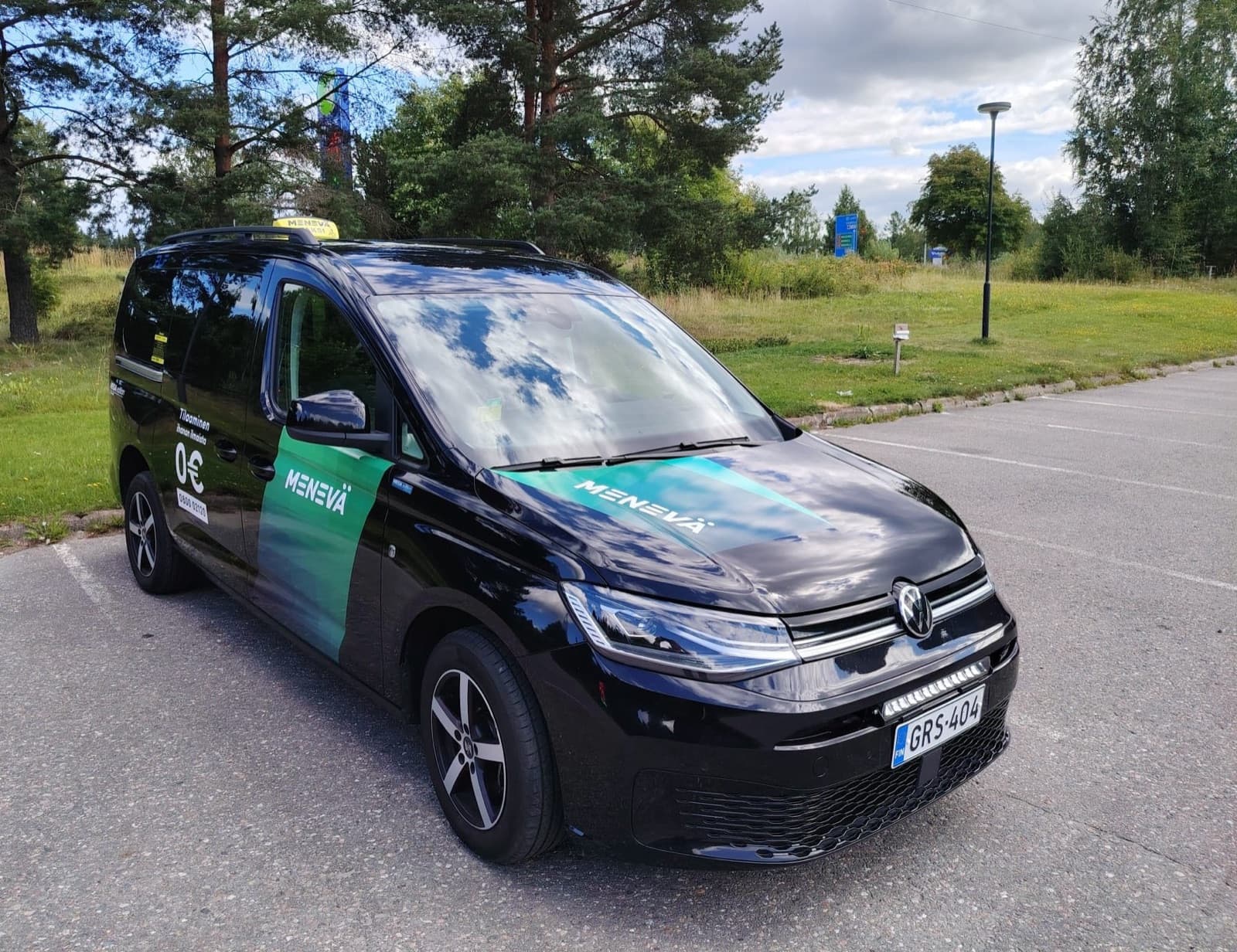 Black accessible Volkswagen Caddy Maxi taxi